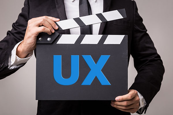 man-holds-ux-clapboard